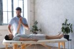 medium-shot-physiotherapist-helping-patient.jpg